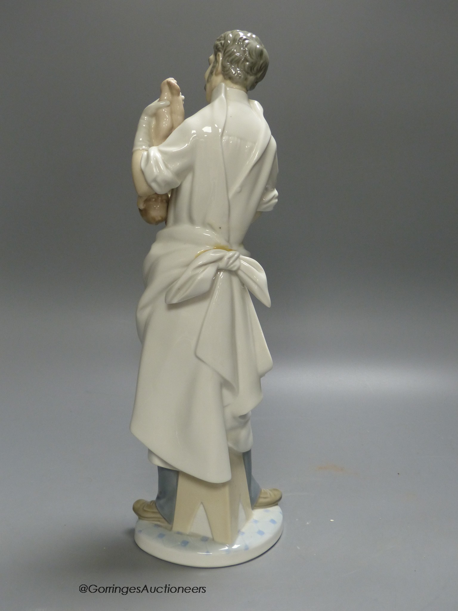 A Lladro figure of a doctor, 36cm high